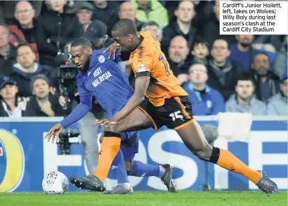  ??  ?? Cardiff’s Junior Hoilett, left, takes on Wolves; Willy Boly during last season’s clash at the Cardiff City Stadium