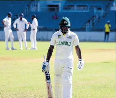  ?? PHOTO BY LENNOX ALDRED ?? Jamaica Scorpions captain Jermaine Blackwood leaves the field after being bowled for a duck against the Barbados Pride at Sabina Park yesterday.