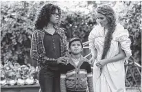  ?? THE ASSOCIATED PRESS ?? Storm Reid, Deric McCabe and Reese Witherspoo­n, from left, star in a scene from “A Wrinkle In Time.”