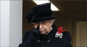  ?? CHRIS JACKSON, GETTY IMAGES ?? The Queen watches the Remembranc­e Sunday memorial from a nearby balcony.