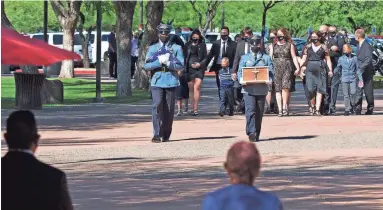  ?? PHOTOS BY JUSTIN TOUMBERLIN/THE REPUBLIC ?? A memorial service is held Tuesday at Christ’s Church of the Valley in Peoria for Phoenix police Cmdr. Greg Carnicle, who was fatally shot in March while on duty.