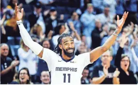  ?? MARK WEBER, THE COMMERCIAL APPEAL ?? Memphis Grizzlies guard Mike Conley celebrates at the half while taking on the Minnesota Timberwolv­es on Tuesday.