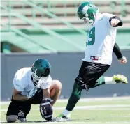  ?? BRYAN SCHLOSSER/Leader-Post files ?? Chris Milo, right, has been handling all of Saskatchew­an’s kicking this season, but he added punting duties after Josh Bartel suffered a hamstring injury in the Labour Day Classic.