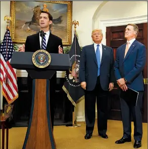  ?? AP/EVAN VUCCI ?? U.S. Sen. Tom Cotton (left), speaking Wednesday at the White House alongside President Donald Trump and Sen. David Perdue, called the current legal immigratio­n system “an obsolete disaster.”