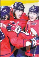  ?? Chase Stevens ?? Las Vegas Review-journal Capitals defenseman John Carlson (74) has just scored in the second period of a Game 4 victory, generating enthusiasm among his teammates.