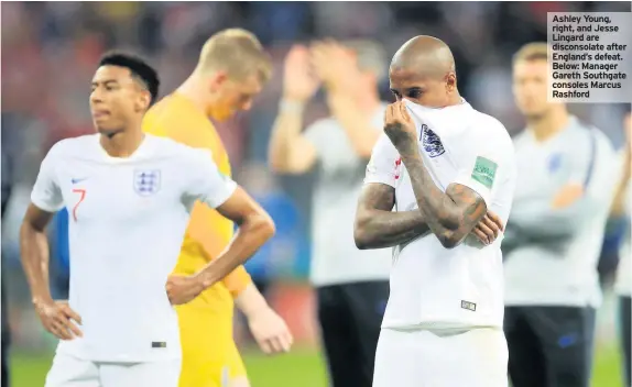  ??  ?? Ashley Young, right, and Jesse Lingard are disconsola­te after England’s defeat. Below: Manager Gareth Southgate consoles Marcus Rashford