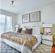  ??  ?? Soft colors, including various shades of white and cream, help make this master bedroom soothing and inviting.