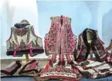  ??  ?? Traditiona­l outfits from Bihor northweste­rn region of Romania are displayed at the local museum of Beius, Romania.