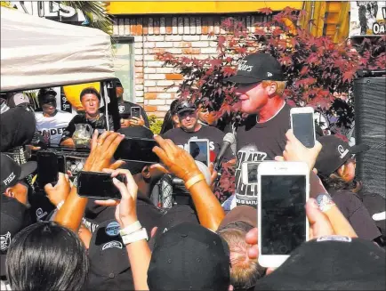  ?? Chris Booker ?? Las Vegas Review-journal @Bookerc94 Coach Jon Gruden addresses Raiders fans at a free barbecue at Ricky’s Sports Theatre and Grill in San Leandro, Calif.