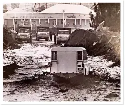  ??  ?? DISASTER RELIEF. A police Land Rover wades through the mud. The archive photo was taken a few days after the flood, when clearing operations had already begun. Karoo Biltong (pictured right) is housed in one of the few buildings that survived the 1981...