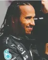  ?? POOL VIA REUTERS ?? Lewis Hamilton won the British Grand Prix on Sunday on three wheels and a flat tire, team officials said.