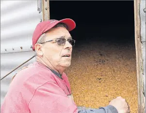  ?? AP PHOTO/NATI HARNIK ?? In this Tuesday, April 4, 2017, photo, Blake Hurst, a corn and soybean farmer and president of the Missouri Farm Bureau, stands by a corn silo on his farm in Westboro, Mo.