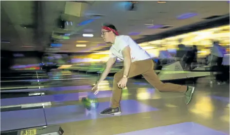  ?? JULIE JOCSAK/ STANDARD STAFF ?? Stephen Mannell of Crawford, Smith and Swallow Chartered Accountant­s LLP, takes her turn bowling during the Big Brothers Big Sisters of St. Catharines, Thorold and District Tim Hortons Bowl for Kids Sake event at Parkway Lanes on Saturday. Teams...