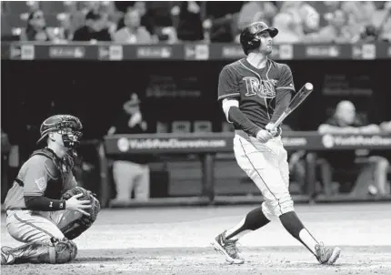  ?? BRIAN BLANCO/GETTY IMAGES ?? Tampa Bay’s Brad Miller watches his three-run homer in front of Orioles catcher Chance Sisco during the fourth inning. Miller brought a halt to Miguel Castro’s first major league start. Castro opened the night with three shutout innings before...