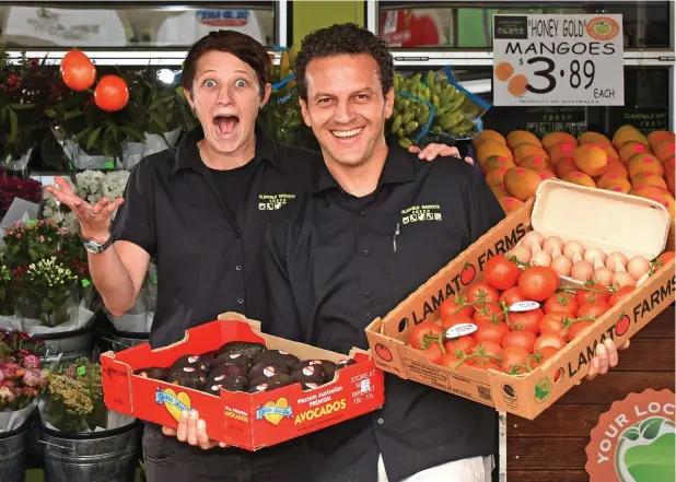  ?? Picture: AAP IMAGE ?? FRESH FEAST: Clayfield Markets staff members Kelly Hunter and Dario Placco with some avocado, egg and tomatoes.