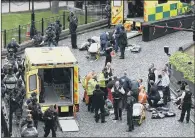  ??  ?? DEADLY ATTACK: Emergency services outside the Palace of Westminste­r where PC Keith Palmer was fatally stabbed.
