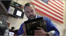  ?? RICHARD DREW — THE ASSOCIATED PRESS ?? Trader Kevin Lodewick works on the floor of the New York Stock Exchange, Wednesday.