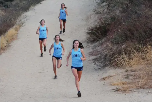  ?? Ryan Painter & Christian Monterrosa/The Signal (See additional photos on signalscv.com) ?? Saugus cross country’s Mariah Castillo runs down a hill at Central Park on Monday. Castillo is The Signal’s All-SCV girls cross country runner of the year.