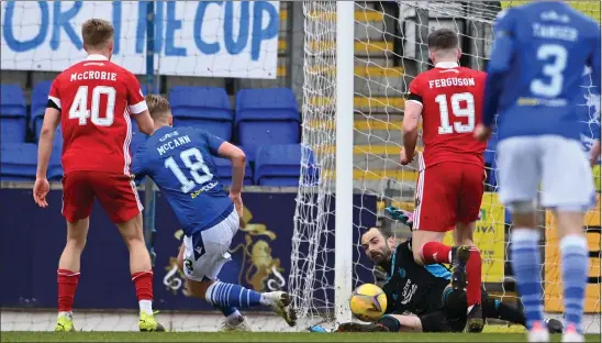  ??  ?? Joe Lewis shows good reflexes to keep Ali McCann out during Aberdeen’s victory over St Johnstone at McDiarmid Park