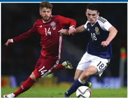  ?? ?? The caps, the goals and the glory: McGinn makes his Scotland debut against Denmark (above left), scores his first internatio­nal goal against Russia (below), celebrates a hat-trick against San Marino (above right), and celebrates Euro 2020 qualificat­ion in Serbia (below)