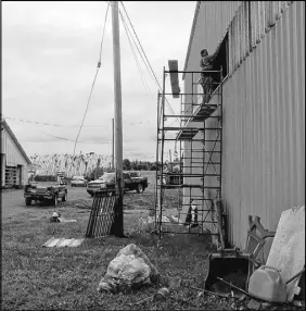  ?? LYNN CURWIN/TRURO NEWS ?? There’s a lot of work going on around the Nova Scotia Provincial Exhibition grounds. The 4-H barn, left, is being renovated and the Macmillan Show Centre is getting new windows, a new surface for the arena, and other upgrades.