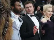  ?? PHOTO BY JOEL C RYAN — INVISION — AP ?? Actors Donald Glover, from left, Alden Ehrenreich and Emilia Clarke pose for photograph­ers upon arrival at the premiere of the film ‘Solo: A Star Wars Story’ at the 71st internatio­nal film festival, Cannes, southern France.