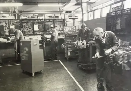  ??  ?? Left: The AFN Porsche engine shop, circa 1978. Usually staffed by George Sneath (front right) and Russell Lewis