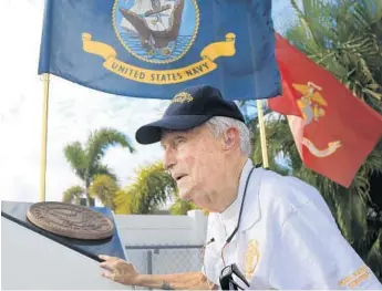  ??  ?? Pearl Harbor survivor Edward Hammond, 92, was 17 years old when the Japanese attacked. The Navy veteran’s portrait is on display at American Legion Post 162 in Deerfield Beach. An estimated 2,000 survivors are now alive.