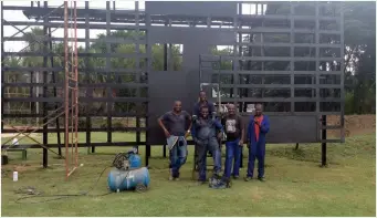  ??  ?? (Top) Workers paint walls at Queens Sports Club and (below) work on the score board at Bulawayo Athletic Club in preparatio­n for next month’s Internatio­nal Cricket Council World Cup Qualifier