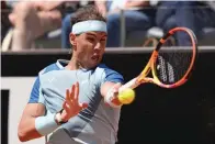  ?? The Associated Press ?? Rafael Nadal returns the ball to John Isner during their match at the Italian Open Wednesday in Rome.