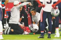  ?? DARRYL WEBB/ASSOCIATED PRESS ?? Arizona Cardinals quarterbac­k Kyler Murray lies on the ground after he was injured during Monday’s game against the New England Patriots in Glendale, Ariz. Murray will miss the remainder of the year due to a torn ACL.