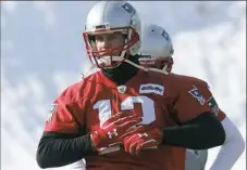  ??  ?? Patriots quarterbac­k Tom Brady warms up during practice Friday in Foxborough, Mass.