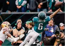  ?? Chris Szagola/Associated Press ?? DeVonta Smith’s fourth-down conversion on the Eagles’ first drive of the NFC title game was evidence of their aggressive­ness.