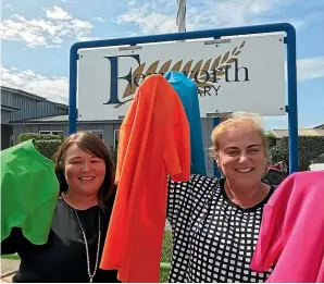  ?? STUFF ?? Fernworth Primary School deputy principal Carla Wilson and principal Alison Cook with the new multi-coloured uniforms with a new logo the school would be unveiling on Thursday.