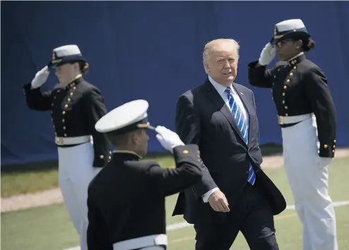  ?? DREW ANGERER / GETTY IMAGES ?? U. S. President Donald Trump arrives at the commenceme­nt ceremony at the U. S. Coast Guard Academy Wednesday.