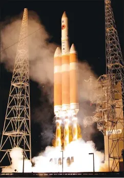  ?? Associated Press photo ?? A Delta IV rocket, carrying the Parker Solar Probe, lifts off from launch complex 37 at the Kennedy Space Center Sunday in Cape Canaveral, Fla. The Parker Solar Probe will venture closer to the Sun than any other spacecraft and is protected by a first-of-its-kind heat shield and other innovative technologi­es that will provide unpreceden­ted informatio­n about the Sun.