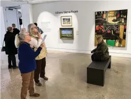  ?? ?? Jackie Potts and Gayle Kencheff take in artwork in one of the new gallery spaces during the Springfiel­d Museum of Art’s celebratio­n of its north wing’s reopening on Saturday.