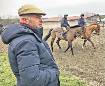  ??  ?? Watching brief: Emmanuel Clayeux casts his eyes over his charges as he gets them prepared for the Cheltenham Festival