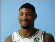  ?? STEVEN SENNE — THE ASSOCIATED PRESS FILE ?? In this file photo, Boston Celtics’ Marcus Smart poses during NBA basketball media day, in Canton, Mass. The Celtics have re-signed guard Marcus Smart. A person with knowledge of the agreement tells The Associated Press that Smart signed a four-year, $52 million contract with the Celtics.