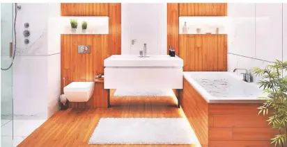  ?? FOTO: ISTOCK ?? Die Kombinatio­n von Holz mit weißer Sanitärker­amik ist nicht nur modern, sondern wirkt auch warm und gemütlich.