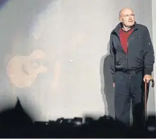  ??  ?? SLOWER PACE: Phil Collins used a cane to walk onto the TD Garden stage Tuesday night.
