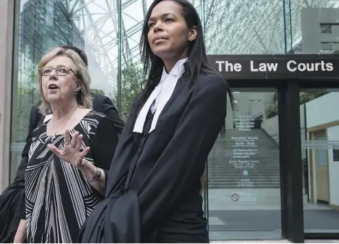  ?? DARRYL DYCK / THE CANADIAN PRESS ?? Green Leader Elizabeth May, left, and lawyer Andi Mackay discuss her guilty plea in Vancouver on Monday.