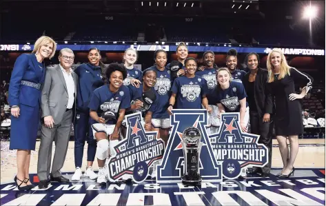  ?? Jessica Hill / Associated Press ?? UConn poses for a team photo after defeating Cincinnati in the AAC tournament finals at Mohegan Sun Arena on March 9 in Uncasville.