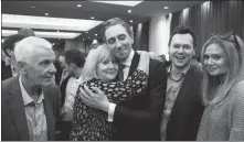  ?? CLODAGH KILCOYNE / REUTERS ?? Simon Harris (third from left), celebrates with his family, after being announced as the new leader of Fine Gael at the party’s leadership election convention, in Athlone, Ireland, on Sunday. Harris is expected to be formally elected prime minister in the Irish parliament in early April after lawmakers return from their Easter break.