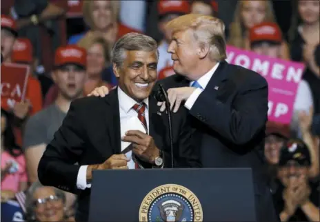  ?? MATT ROURKE — THE ASSOCIATED PRESS ?? President Donald Trump, right, greets Senate candidate Rep. Lou Barletta, R-Pa., during a rally in Wilkes-Barre, Pa. More than 2,600 candidates are running in the midterm elections. But for the president, the election comes down to one person: Donald...