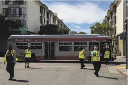  ??  ?? Muni workers come and go outside the bus yard. The city transporta­tion chief is working on a strategy to avoid layoffs.