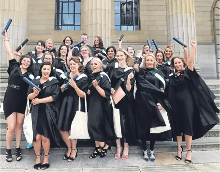  ?? Picture: Kim Cessford. ?? Dundee University graduates celebratin­g in City Square.