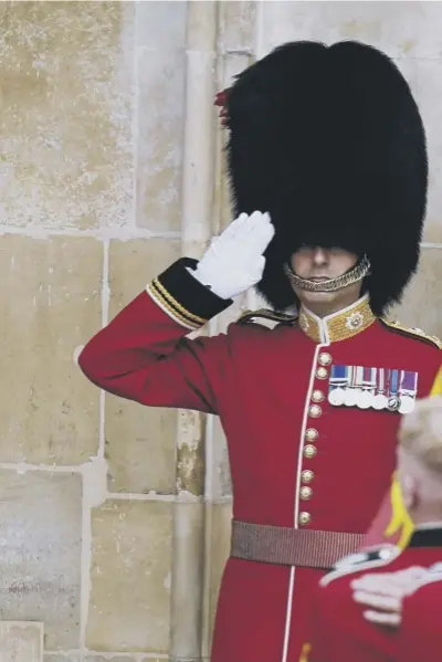  ?? ?? The coffin of Queen Elizabeth II, draped in the Royal Standard with the Imperial State Crown and the