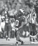  ?? JUNFU HAN/DETROIT FREE PRESS ?? Michigan defensive back Mike Sainristil celebrates a play against Washington during U-M’s 34-13 win in the CFP championsh­ip Monday.