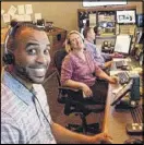  ??  ?? Omar Butcher enjoys a light moment with co-workers in the CNN control room, where a live broadcast was taking place.